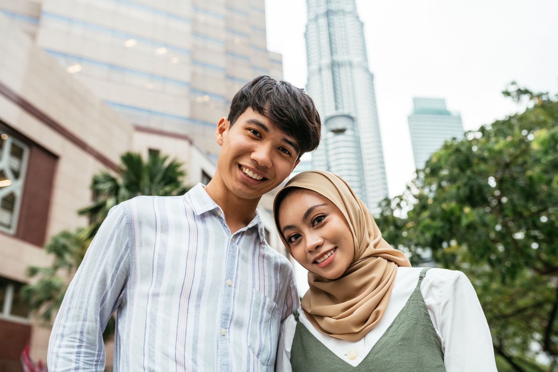 South East Asian couple traveling and enjoying the city break